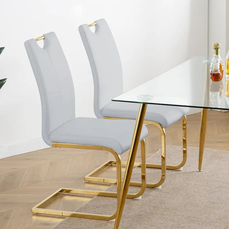 Chaises de salle à manger modernes en similicuir rembourrées avec pieds en métal doré, lot de 2